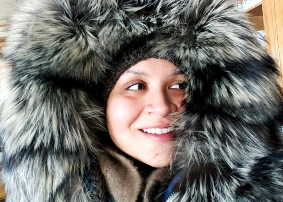 woman wearing a fur covered hood