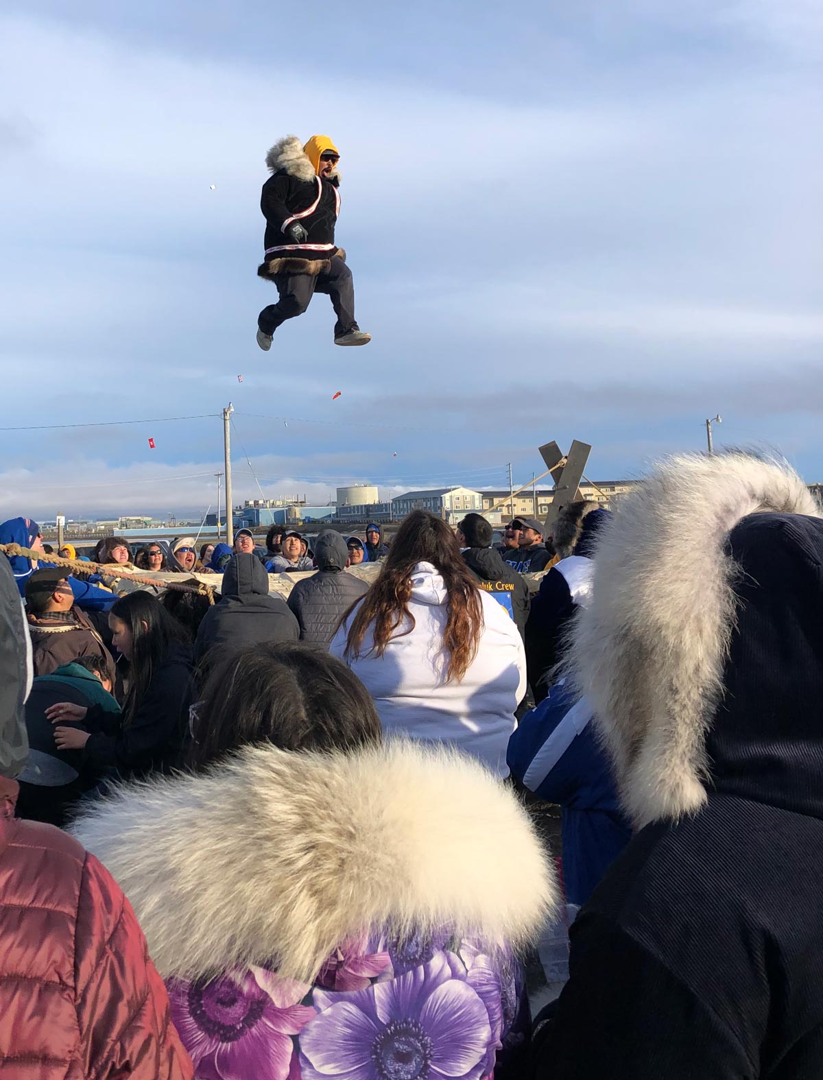 man being thrown up in a blanket toss