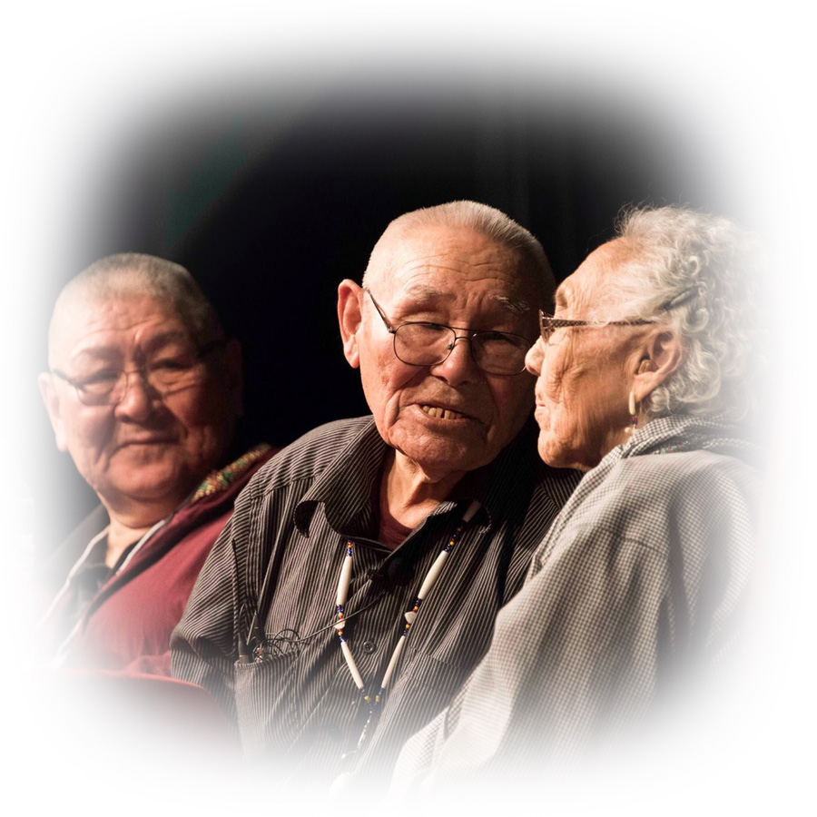 three Native Alaskan males speaking at an event