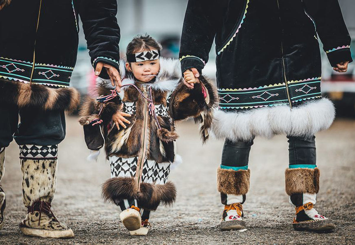 Young girl in full traditional fur attire