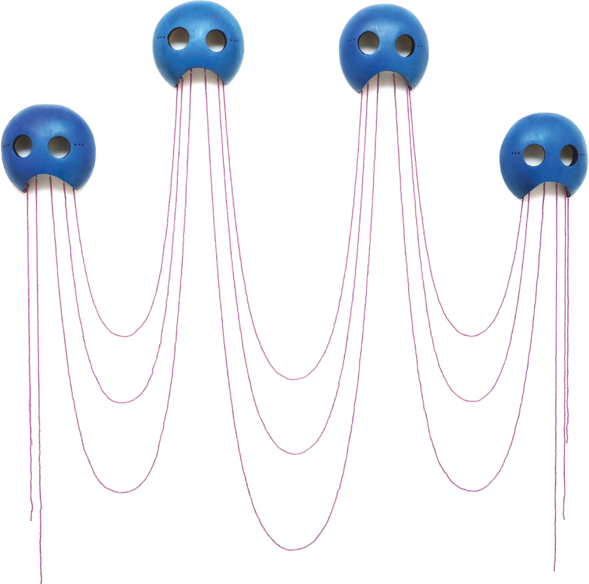 blue Itigiat masks with dangling maroon beads against a white background