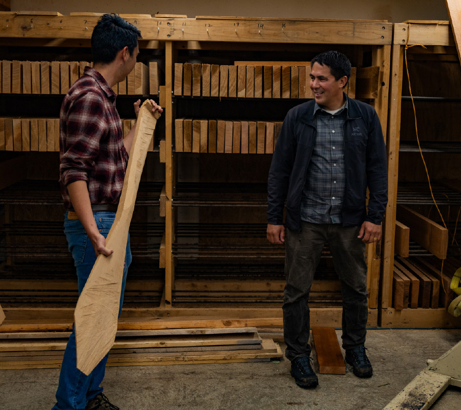 Samuel Hiratsuka and Sealaska looking at cedar planks